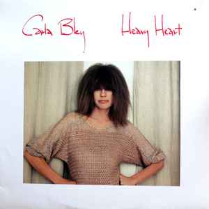 Heavy heart / Carla Bley, org. Carla Bley, org. Steve Slagle, fl. Hiram Bullock, guit. | Bley, Carla (1936-) - pianiste, organiste, compositrice et cheffe d'orchestre de jazz américaine. Org.