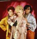 last ned album Thompson Twins - Lay Your Hands On Me King For A Day