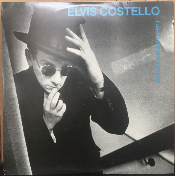 last ned album Elvis Costello - I Left My Honda Outside
