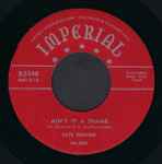 Cover of Ain't It A Shame / La-La, 1955-04-00, Vinyl