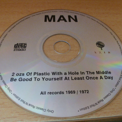 last ned album Man - 2 Ozs Of Plastic With A Hole In The Middle Be Good To Yourself At Least Once A Day