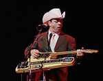 last ned album Download Junior Brown - Too Many Nights In A Roadhouse Gotta Get Up Every Morning album