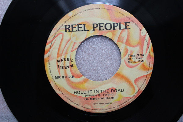 descargar álbum Reel People - Sing Me A Song Hold It In The Road
