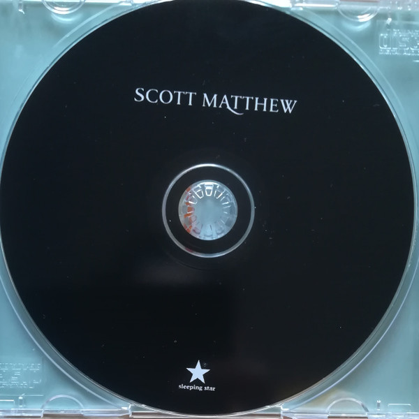 last ned album Scott Matthew - There Is An Ocean That Divides And With My Longing I Can Charge It With A Voltage Thats So Violent To Cross It Could Mean Death